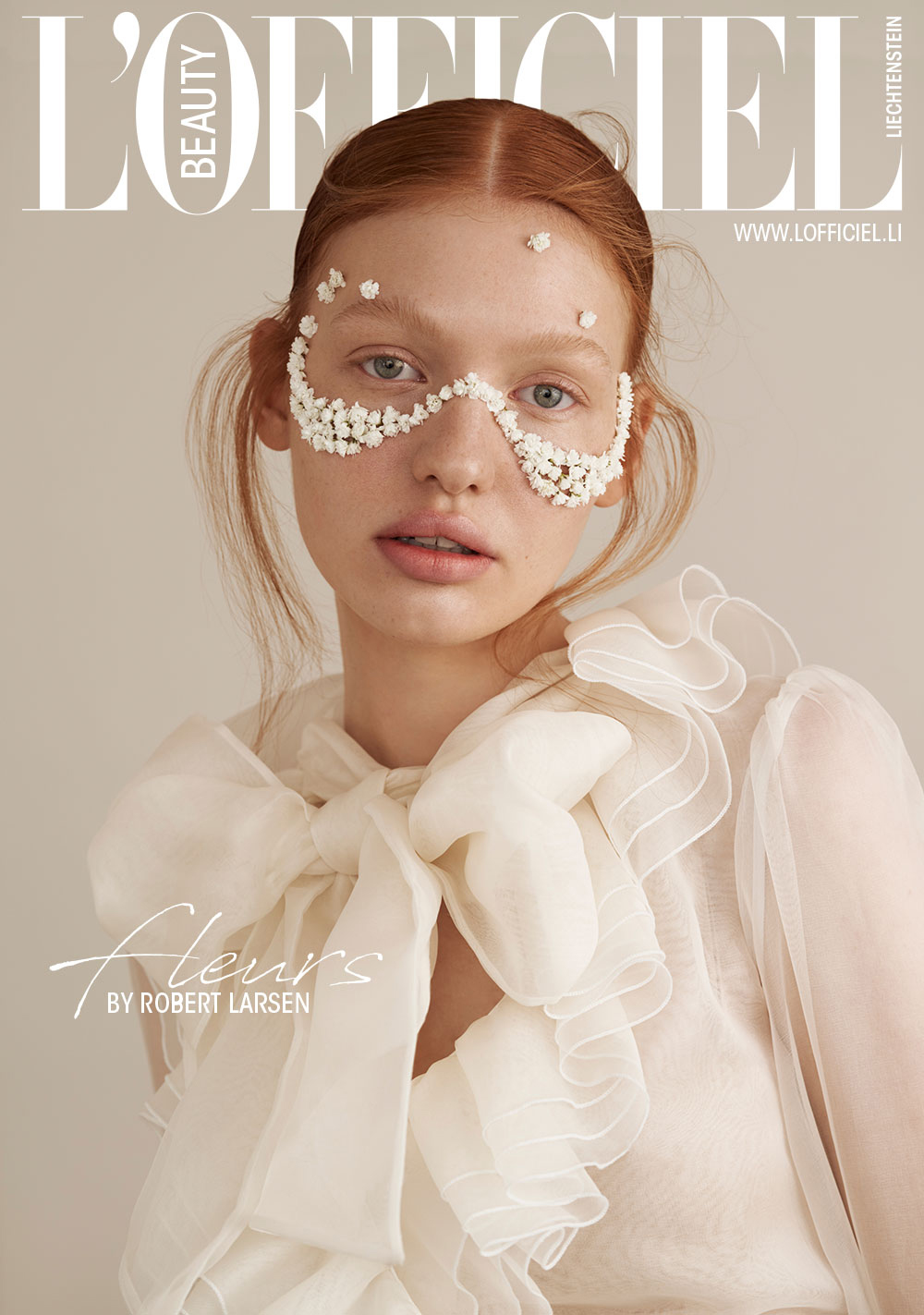 Fashion Stylist Sabine Holderer. Fleurs is a fashion editorial for l'officiel magazine. The red-haired model is wearing a white MSGM blouse with lace details and a bow at the neck. The model has small white flowers glued to her face like a mask.